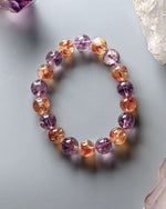 Load image into Gallery viewer, Multicolored beaded bracelet on a light gray background with crystals.