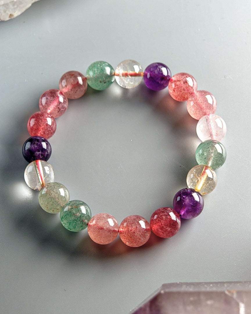 Multicolored beaded bracelet on a light gray background