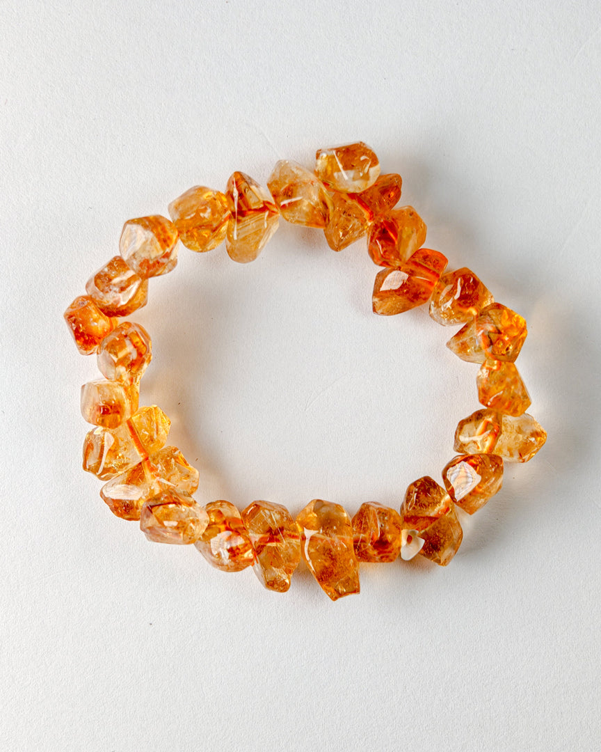 Orange crystal bracelet on a white background