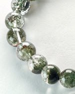 Load image into Gallery viewer, Close-up of Green Phantom Quartz Bracelet (Light Inclusion) on a white background