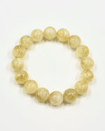 Load image into Gallery viewer, Yellow beaded bracelet on a white background