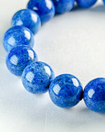 Load image into Gallery viewer, Blue beaded bracelet on a white background