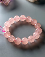 Load image into Gallery viewer, Madagascar Rose Quartz Bracelet on a gray surface