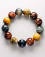 Load image into Gallery viewer, Multicolored beaded bracelet on a white background