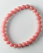 Load image into Gallery viewer, Pink beaded bracelet on a light gray background