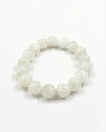 Load image into Gallery viewer, White beaded bracelet on a white background