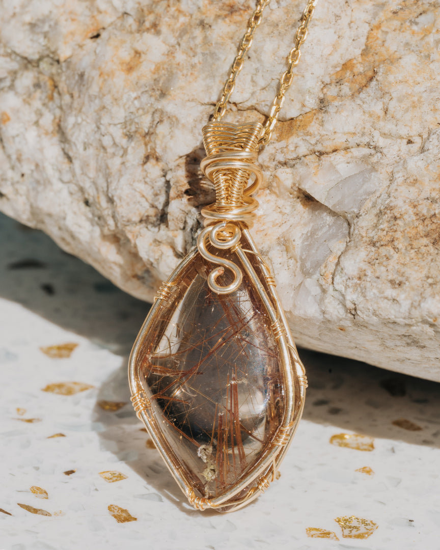 rhombus red rutilated quartz pendant