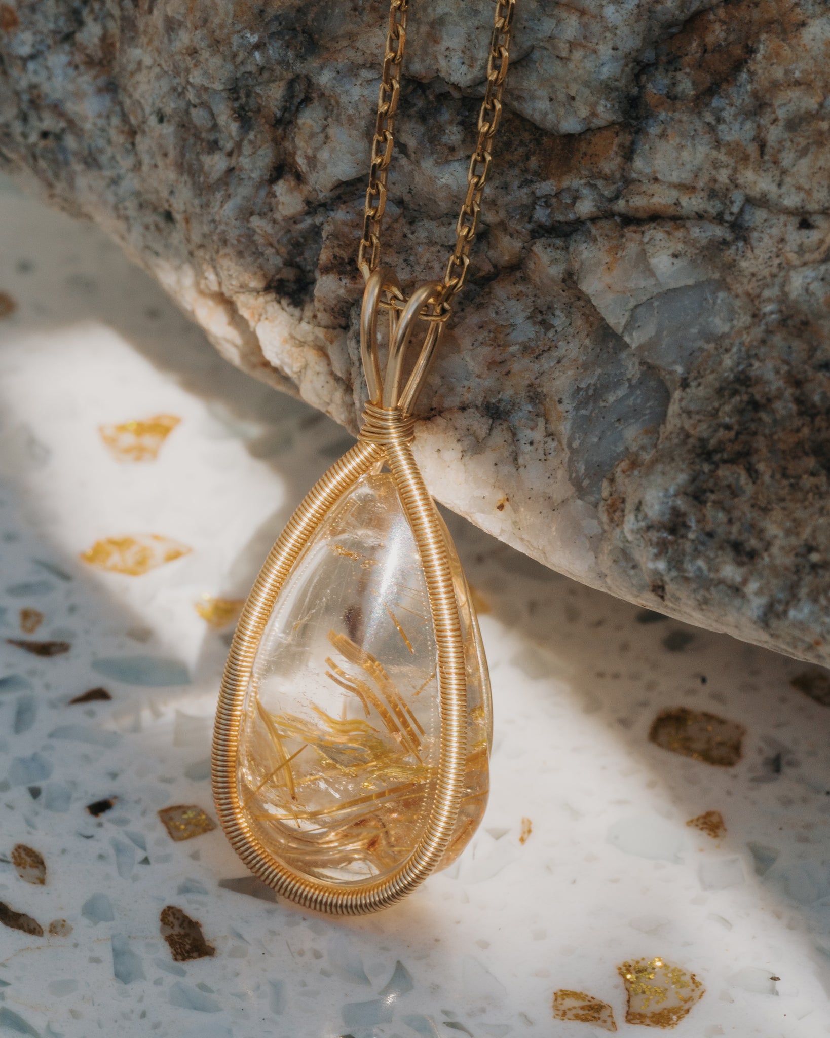 small teardrop golden rutilated quartz pendant