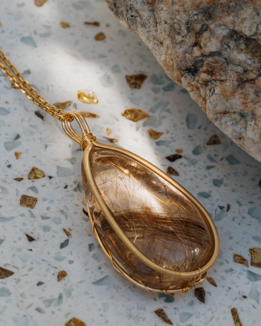 large teardrop golden rutilated quartz pendant