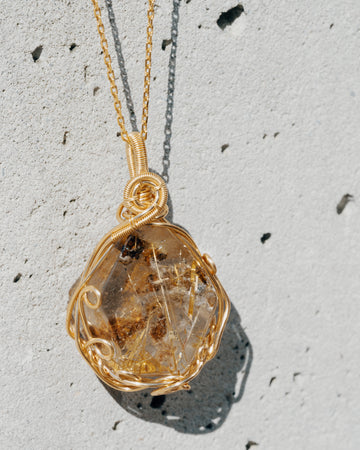 small sphere golden rutilated quartz pendant