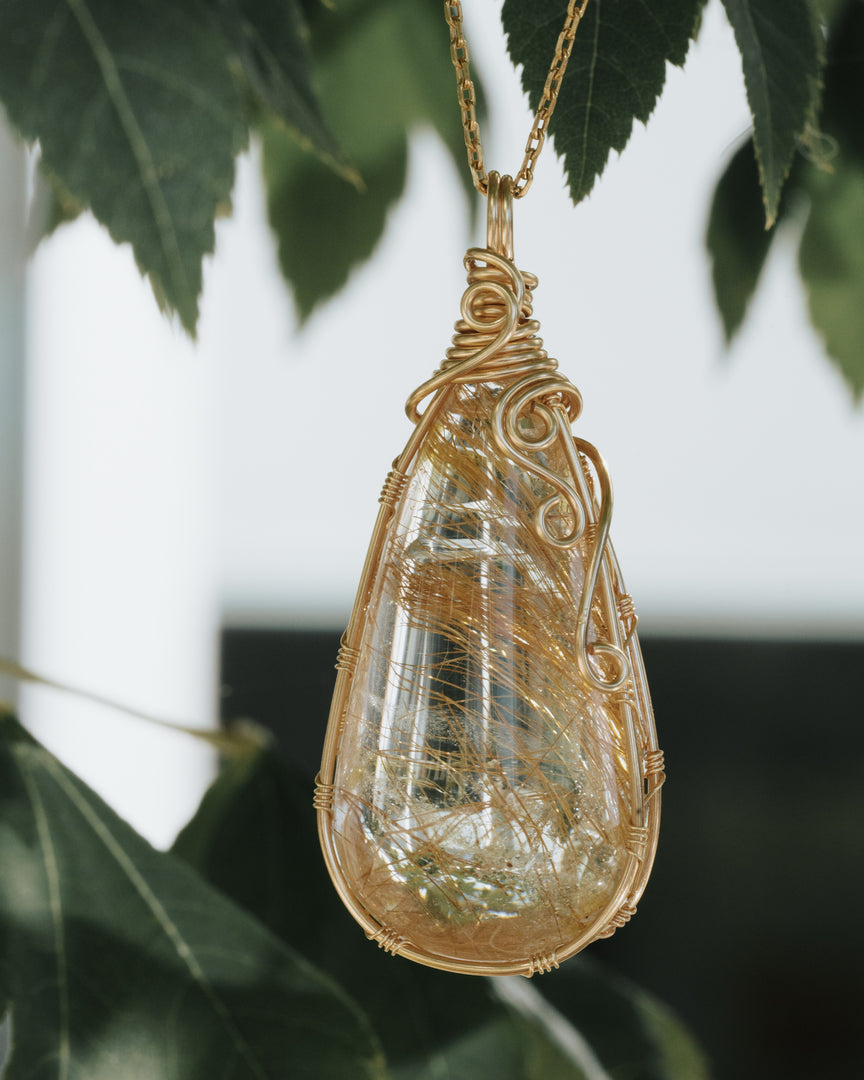 drop shaped golden rutilated quartz pendant