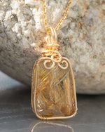 Load image into Gallery viewer, small trapezoid golden rutilated quartz pendant
