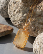 Load image into Gallery viewer, medium golden rutilated quartz amulet pendant
