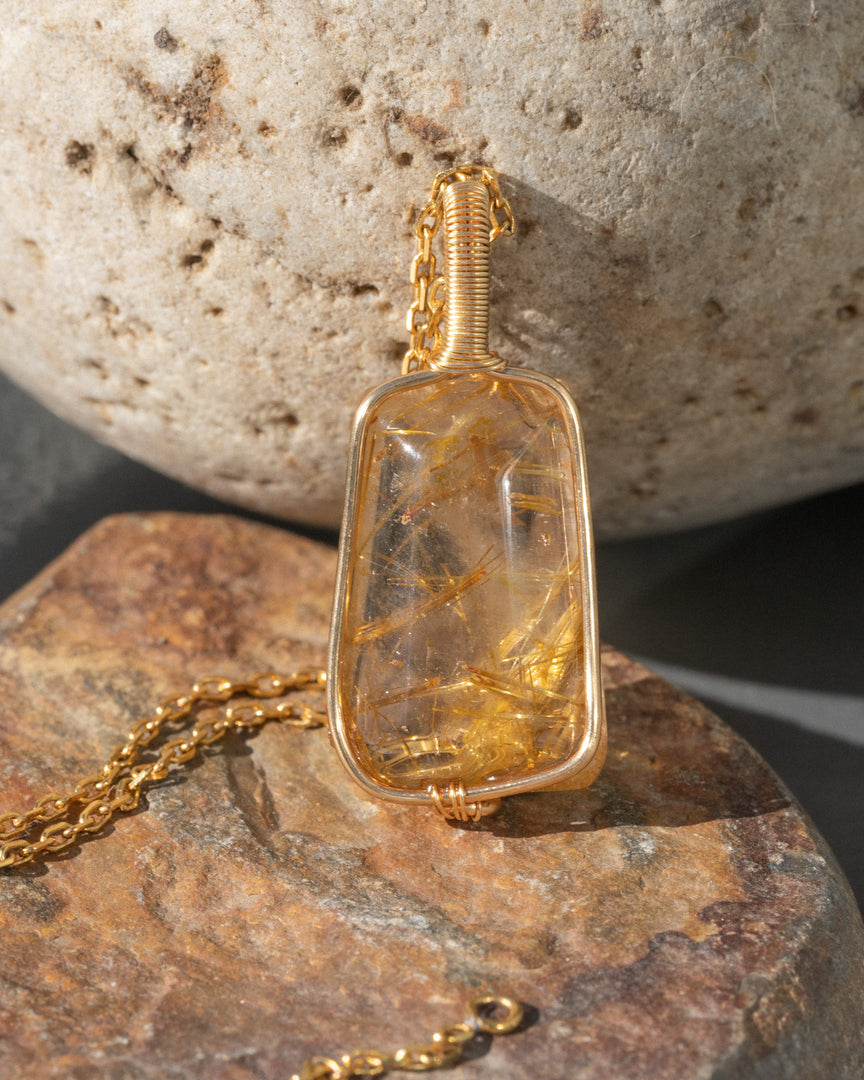 trapezoid golden rutilated quartz pendant