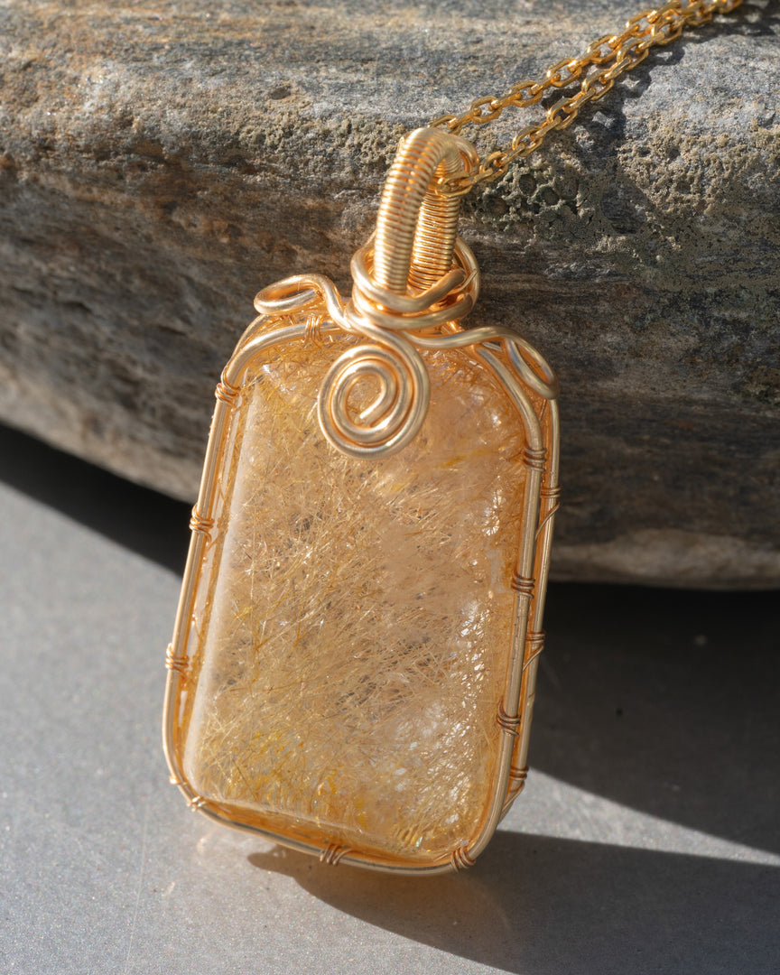 large golden rutilated quartz amulet pendant