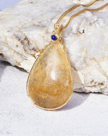 large teardrop golden rutilated quartz pendant