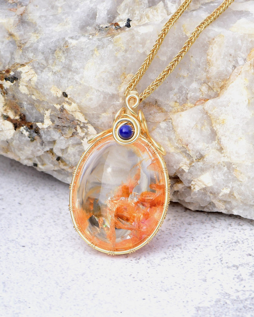 fire flakes oval hematoid quartz pendant