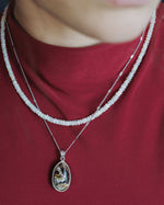 Load image into Gallery viewer, oval golden rutilated quartz pendant in silver setting
