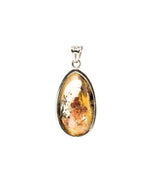 Load image into Gallery viewer, oval golden rutilated quartz pendant in silver setting
