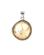 Load image into Gallery viewer, round golden rutilated quartz pendant in silver setting
