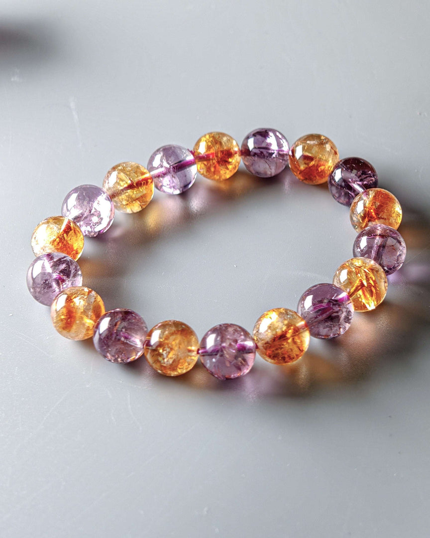 Multicolored beaded bracelet on a light gray background