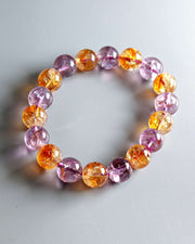 Multicolored beaded bracelet on a light gray background