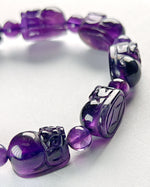 Load image into Gallery viewer, Purple beaded bracelet with silver accents on a white background
