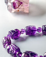 Load image into Gallery viewer, Purple beaded bracelet on a white background
