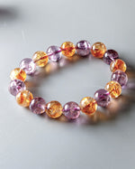 Load image into Gallery viewer, Multicolored beaded bracelet on a light gray background

