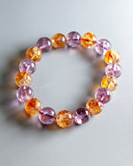 Load image into Gallery viewer, Multicolored beaded bracelet on a light gray background

