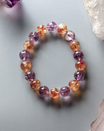 Load image into Gallery viewer, Multicolored beaded bracelet on a light gray background with crystals.
