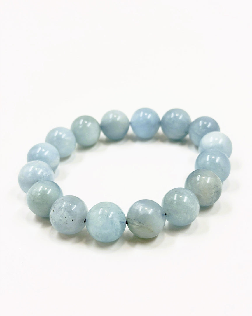 Light blue beaded bracelet on a white background