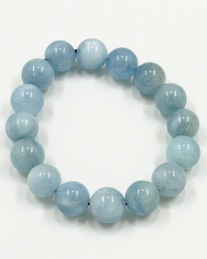 Light blue beaded bracelet on a white background