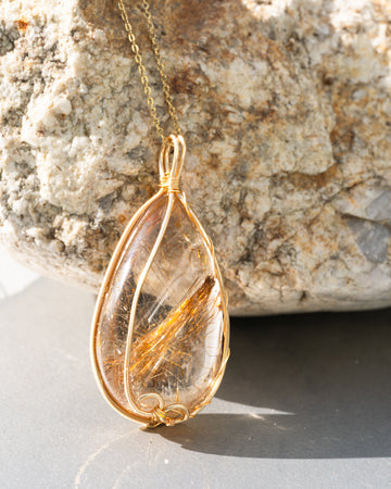 large teardrop golden rutilated quartz pendant