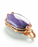 Load image into Gallery viewer, Purple stone pendant with gold wire wrapping on a white background
