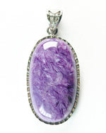 Load image into Gallery viewer, Purple stone pendant with silver frame on a white background
