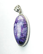 Load image into Gallery viewer, Purple pendant with a silver frame on a white background
