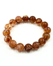 hematoid quartz bracelet on paper