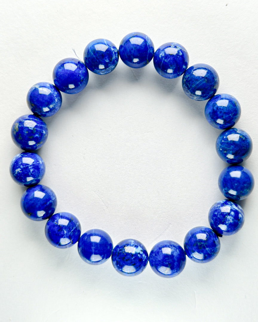 Blue beaded bracelet on a white background
