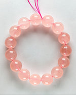 Load image into Gallery viewer, Madagascar Rose Quartz Bracelet on a light gray background