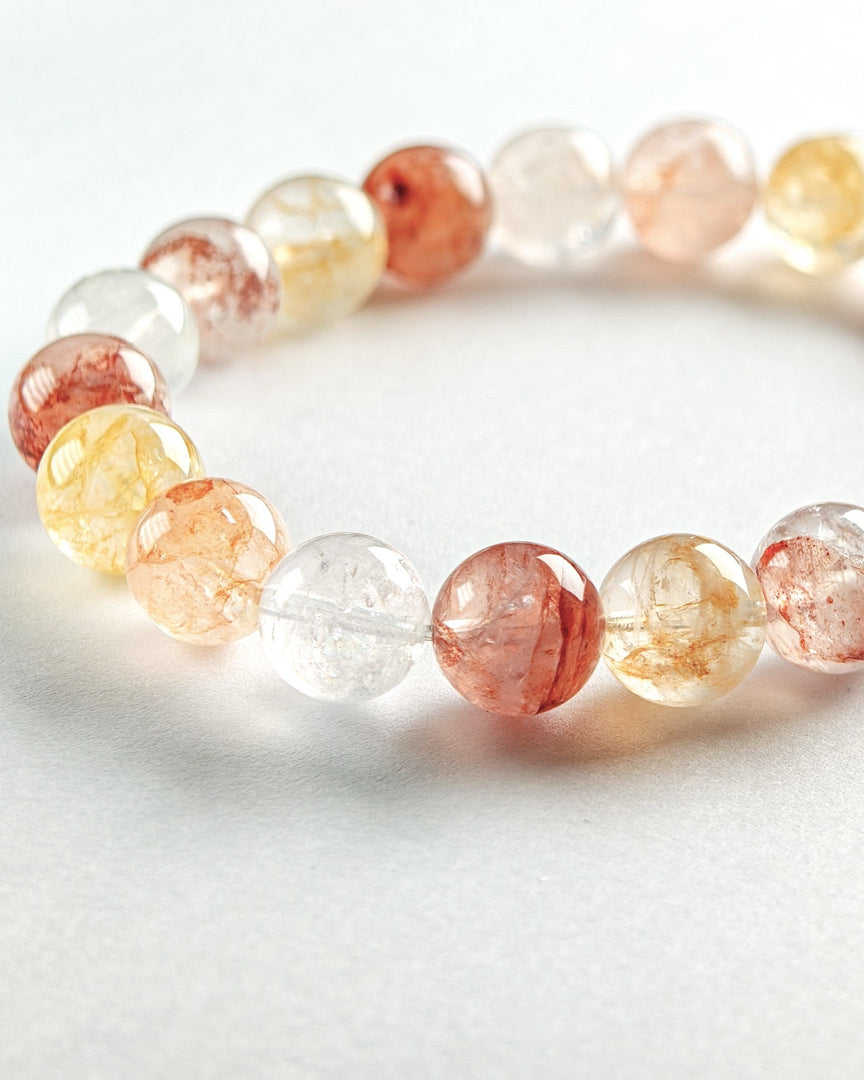 Beaded bracelet with multicolored beads on a white background