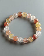 Load image into Gallery viewer, Multicolored beaded bracelet on a gray background
