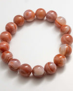 Load image into Gallery viewer, Beaded bracelet with brown and white marbled beads on a white background

