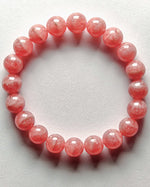 Load image into Gallery viewer, Pink beaded bracelet on a white background
