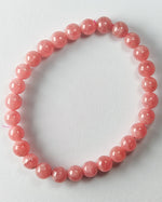 Load image into Gallery viewer, Pink beaded bracelet on a light gray background
