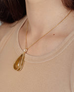 Load image into Gallery viewer, medium teardrop golden rutilated quartz pendant
