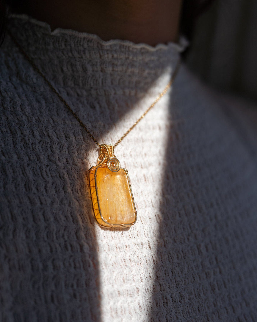 large golden rutilated quartz amulet pendant