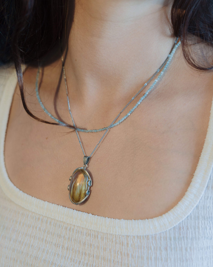 “rabbit hair” quartz pendant in silver setting