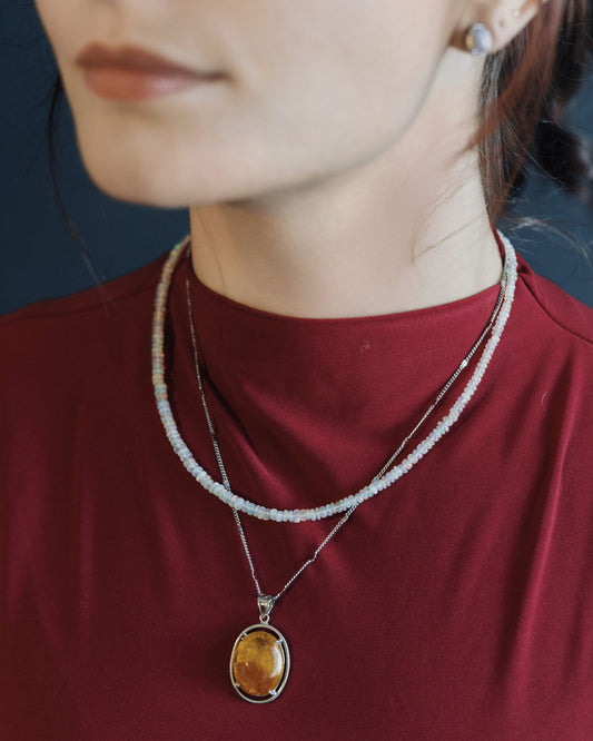 oval “rabbit hair” quartz pendant in silver setting