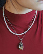 Load image into Gallery viewer, teardrop golden rutilated quartz pendant in silver setting
